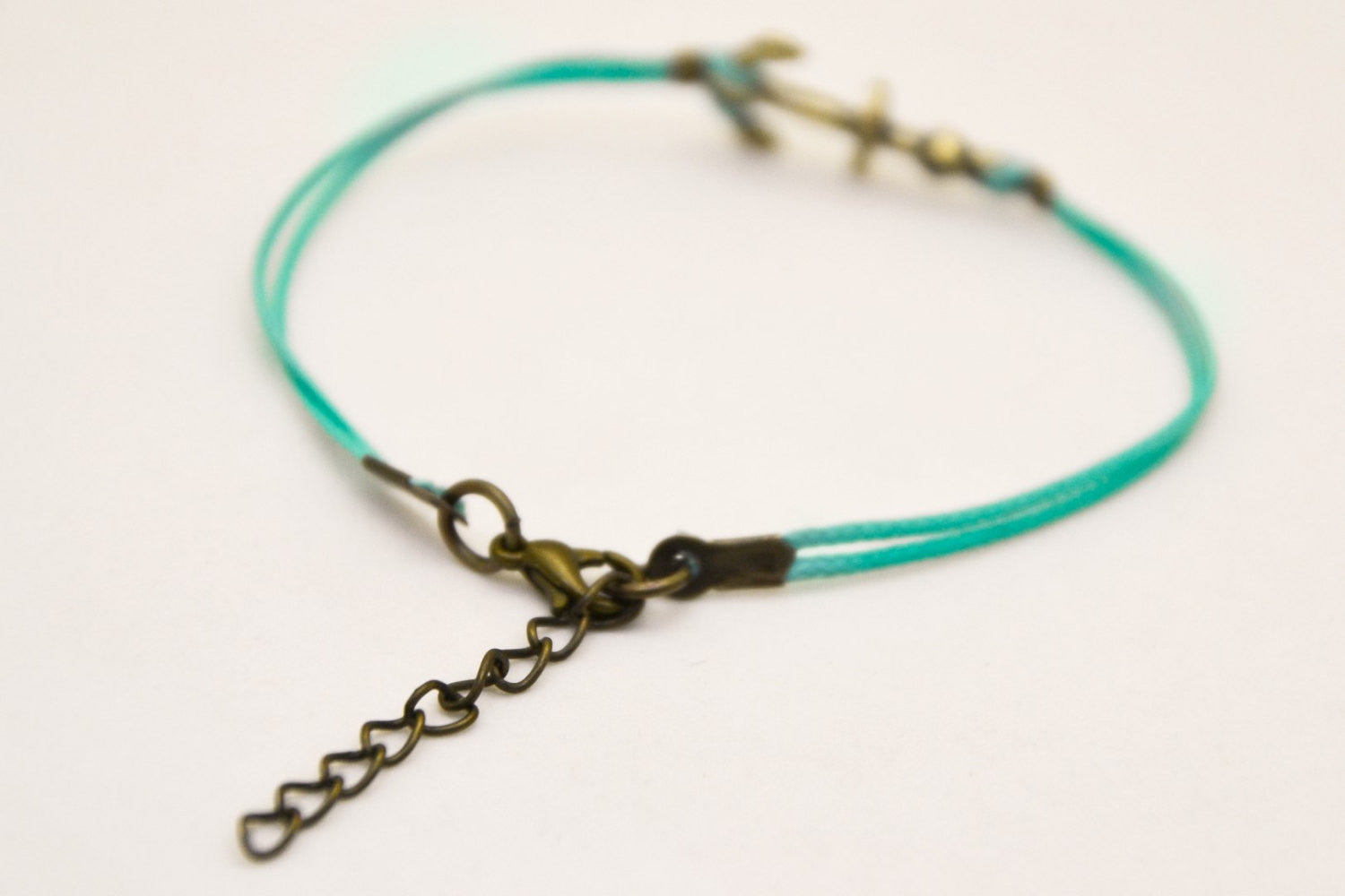 Cord bracelet with a bronze anchor charm, turquoise string - shani-adi-jewerly