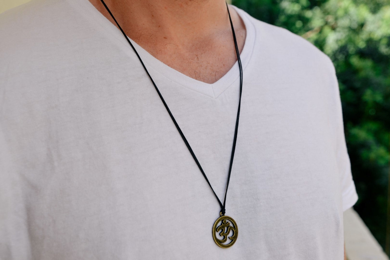 Men's necklace with a bronze Om pendant, black cord - shani-adi-jewerly