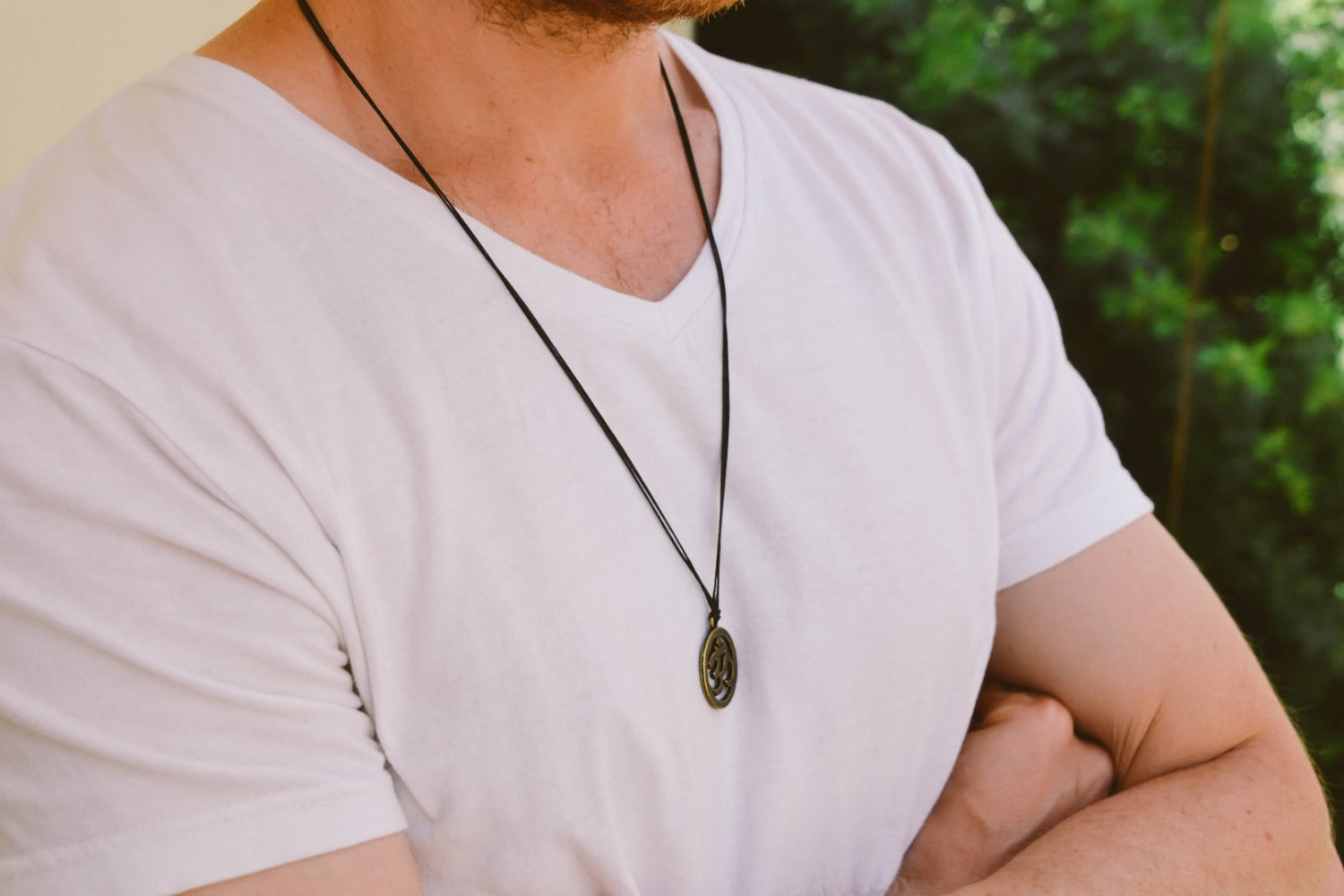 Men's necklace with a bronze Om pendant, black cord - shani-adi-jewerly