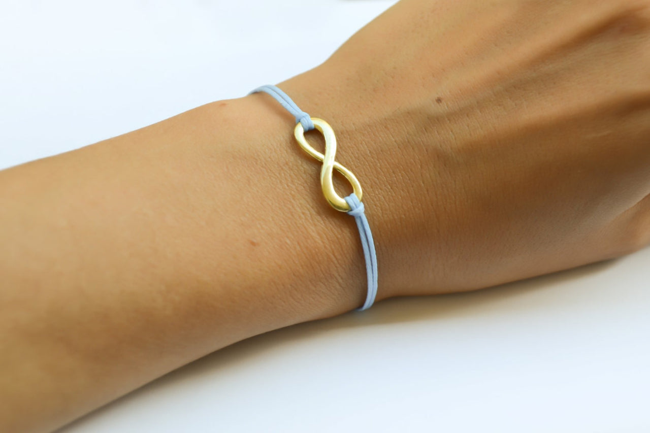Gold infinity bracelet, womens bracelet with a blue cords, adjustable - shani-adi-jewerly