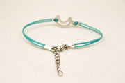 Turquoise cord bracelet with a silver crescent moon charm - shani-adi-jewerly