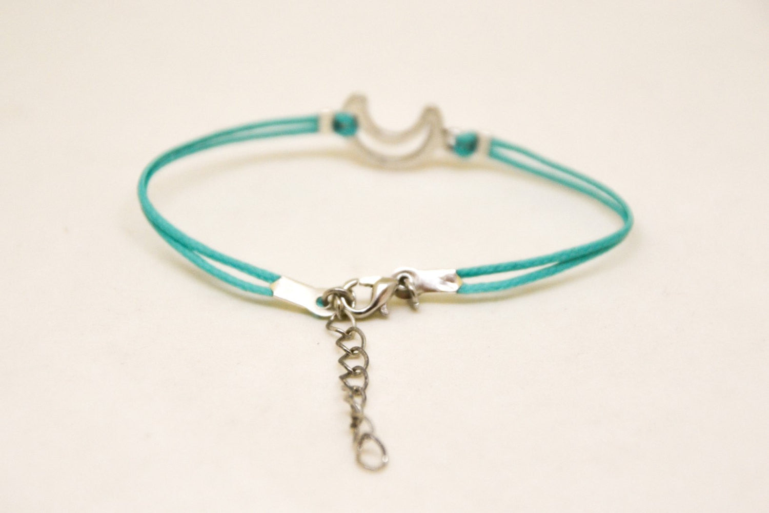 Turquoise cord bracelet with a silver crescent moon charm - shani-adi-jewerly