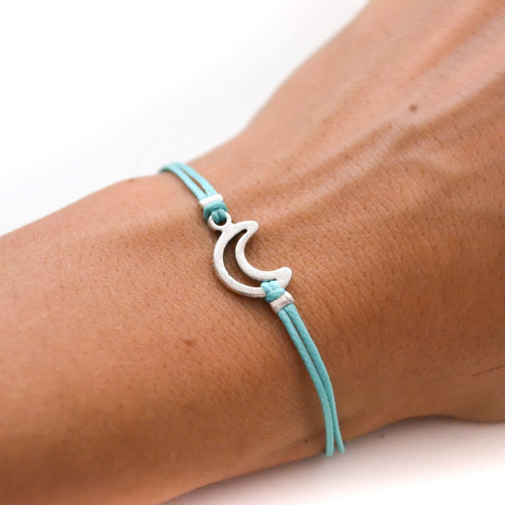 Turquoise cord bracelet with a silver crescent moon charm - shani-adi-jewerly