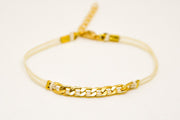 Beige cord bracelet with a gold plated flat chain charm - shani-adi-jewerly