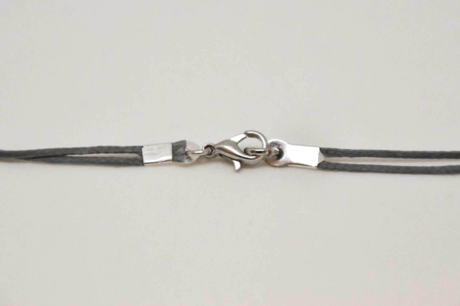 Bull's head necklace for men, gray cord, - shani-adi-jewerly