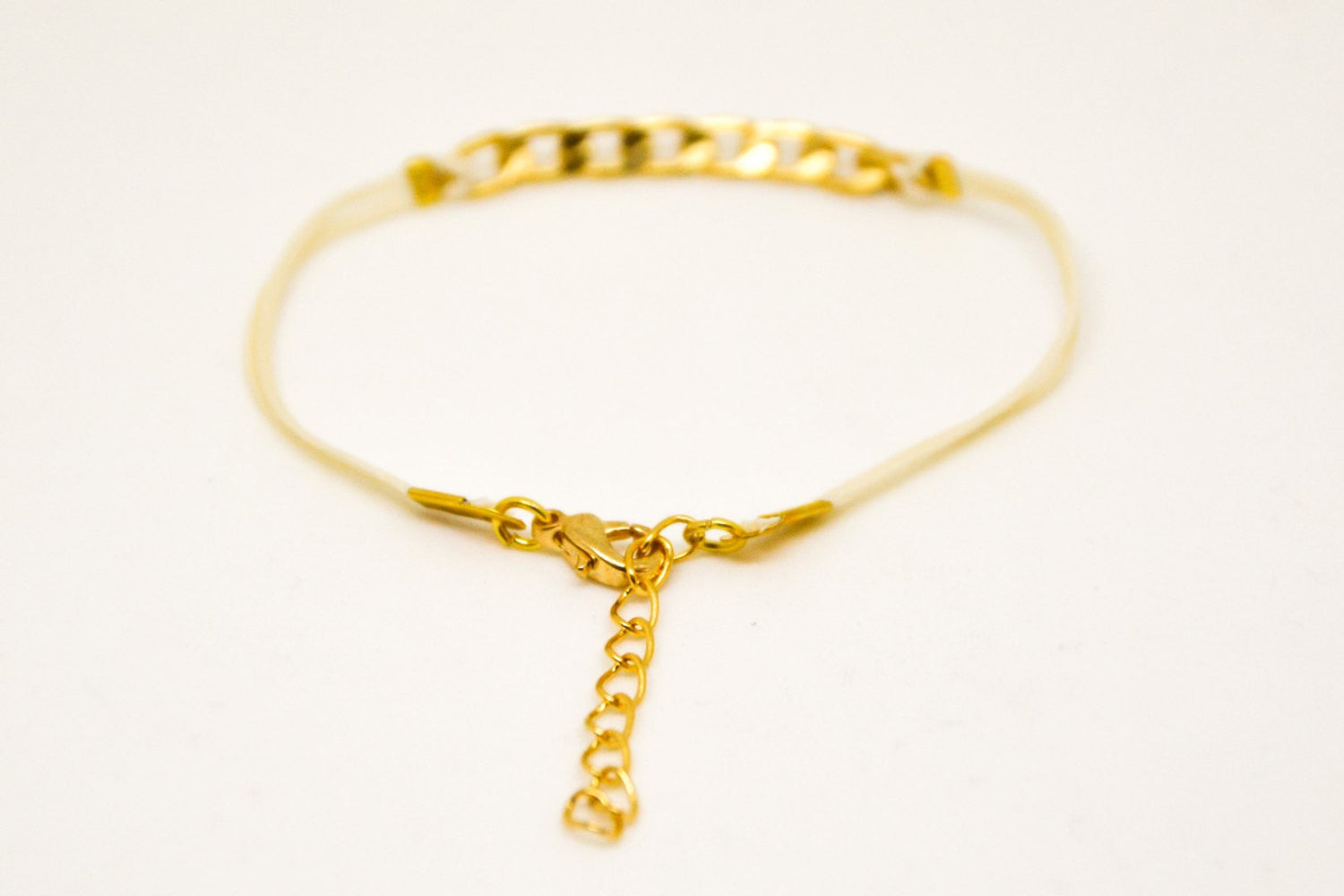 Beige cord bracelet with a gold plated flat chain charm - shani-adi-jewerly