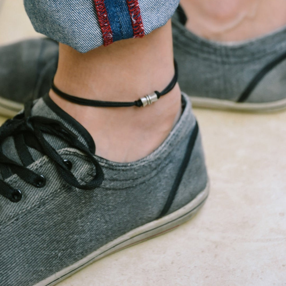 Men's anklet with a silver tube charm and a black cord - shani-adi-jewerly