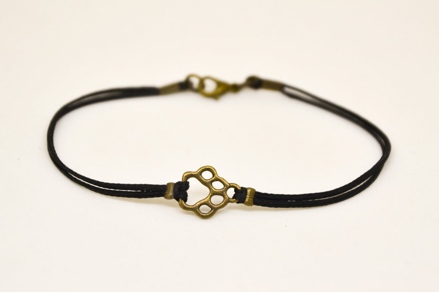 Bronze paw bracelet for men, black cord - shani-adi-jewerly