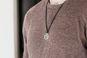 Men's necklace with a silver Om pendant, black cord - shani-adi-jewerly