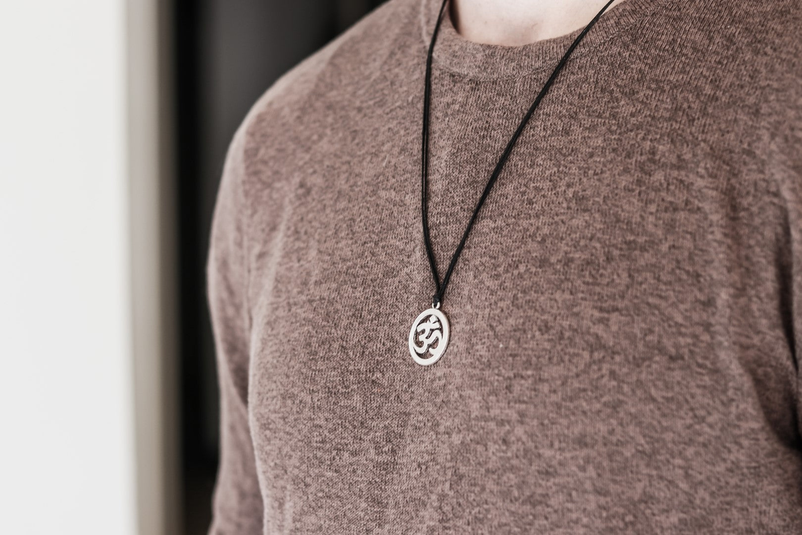 Men's necklace with a silver Om pendant, black cord - shani-adi-jewerly