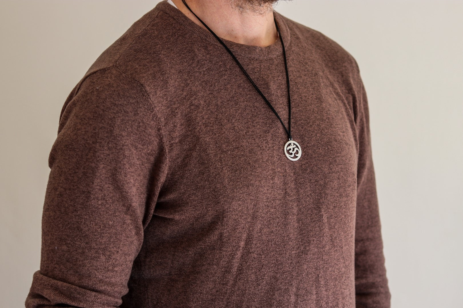 Men's necklace with a silver Om pendant, black cord - shani-adi-jewerly