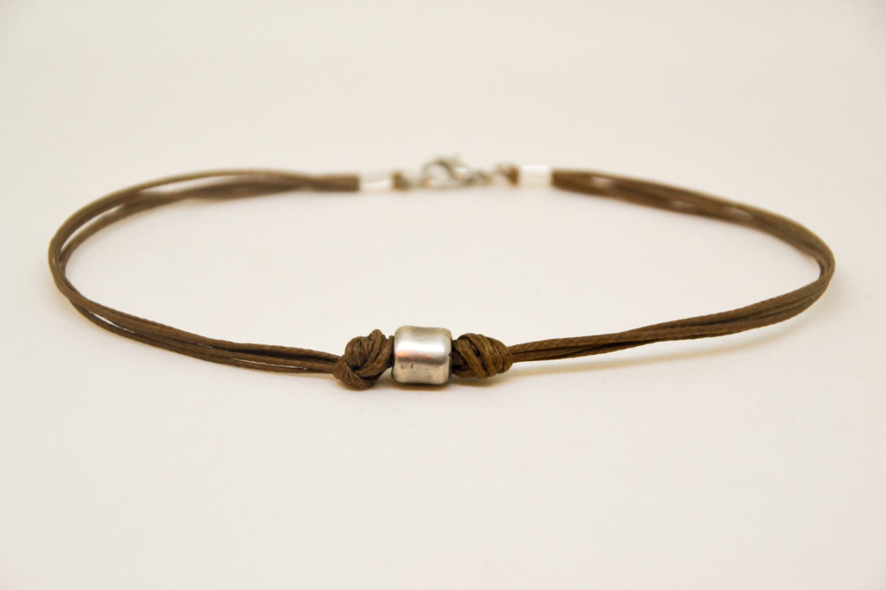 Men's anklet with a silver tube charm and a brown cord - shani-adi-jewerly