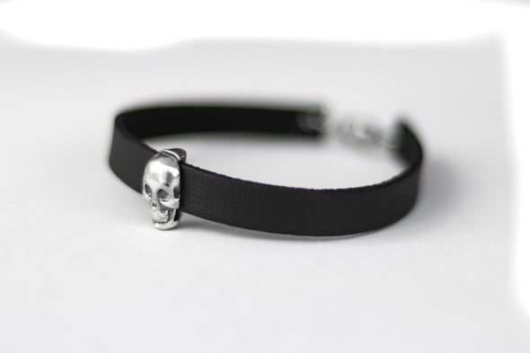 Skull bracelet for men with a black faux leather cuff strap, custom size