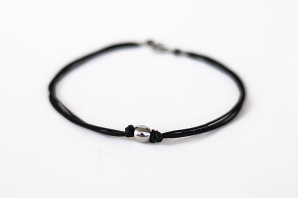 Men's anklet with a stainless steel waterproof bead and a black cord