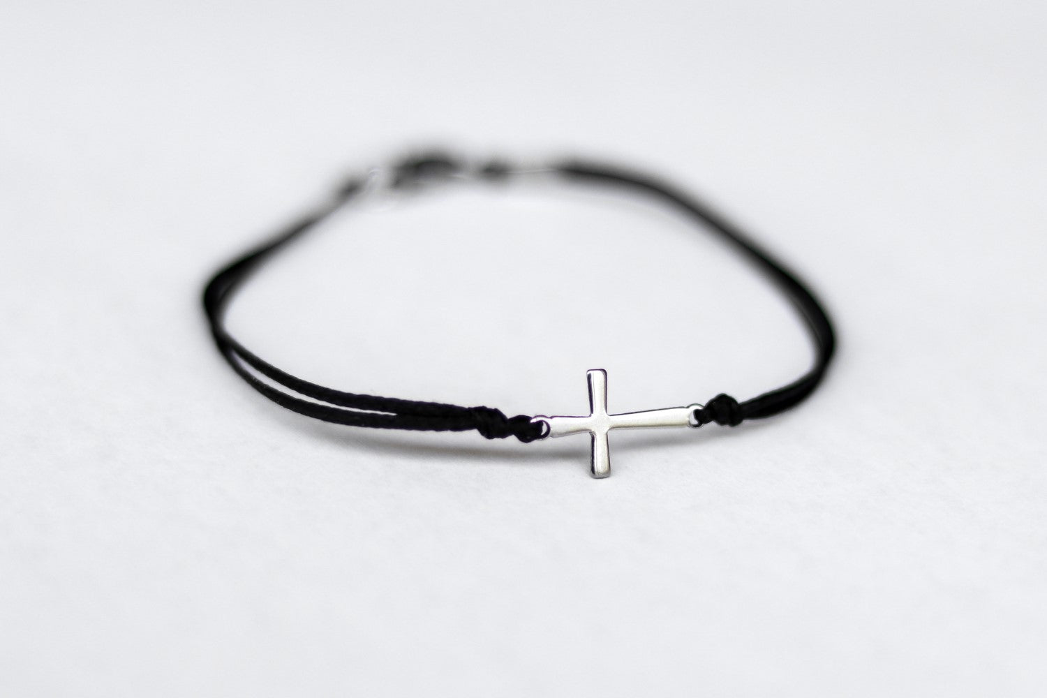 handmade silver cross bracelet for men, black cord - shani and adi jewelry