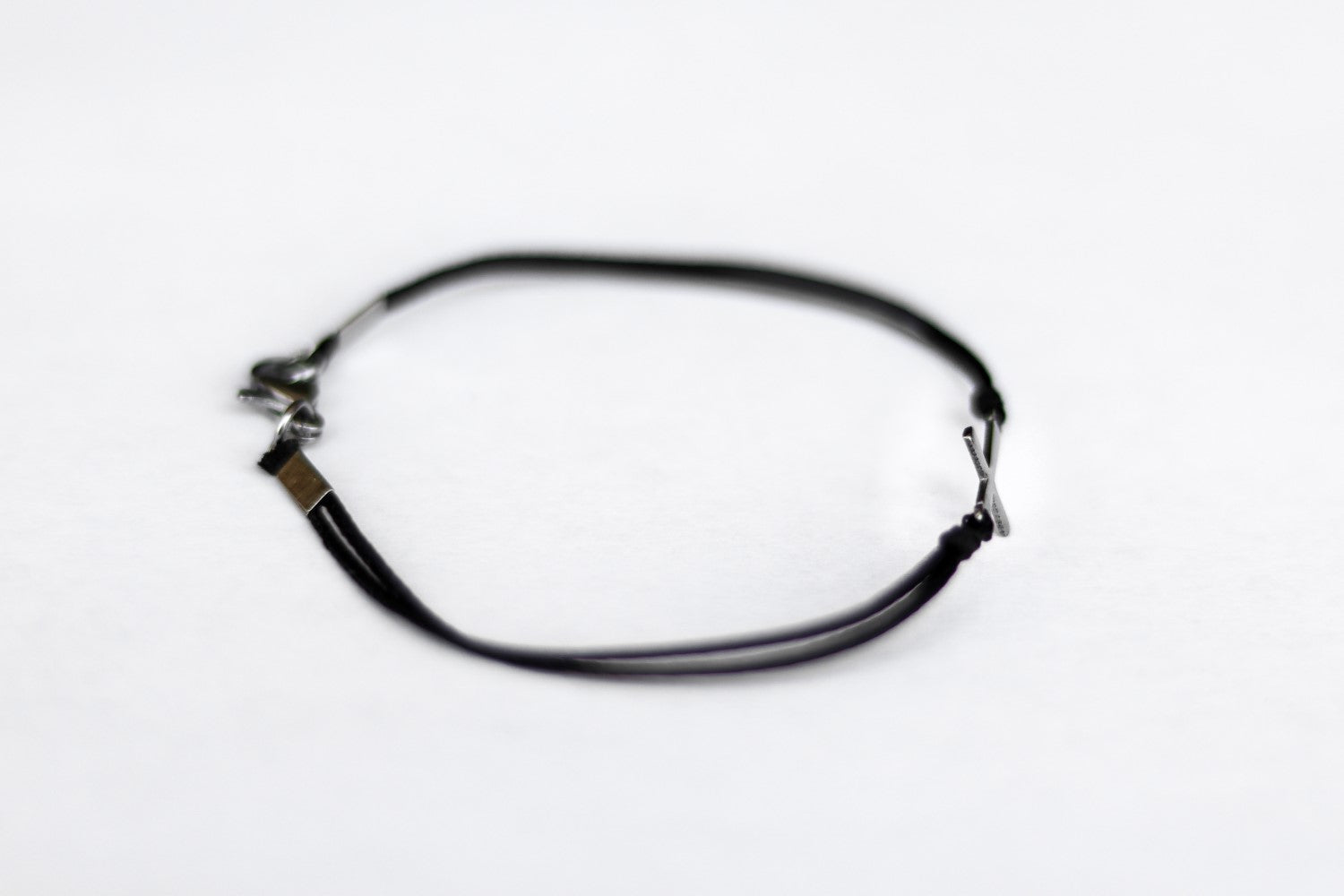 handmade silver cross bracelet for men, black cord - shani and adi jewelry