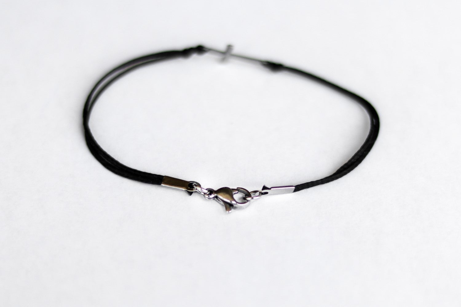 handmade silver cross bracelet for men, black cord - shani and adi jewelry