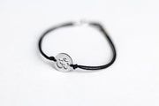 handmade silver om bracelet for men, black cord - shani and adi jewelry