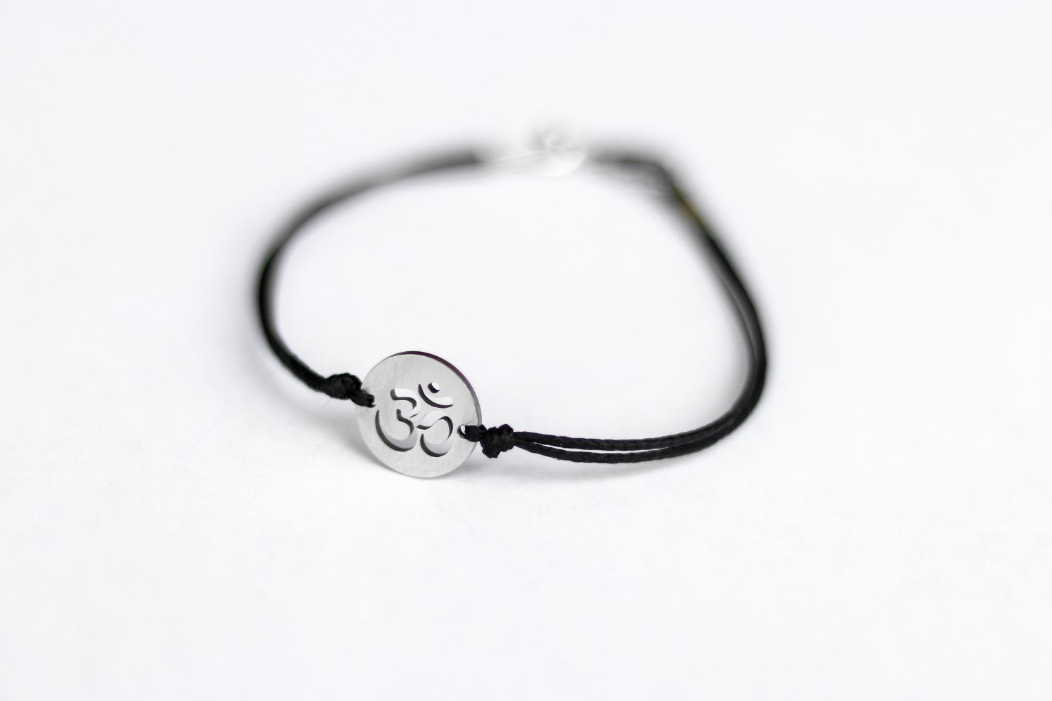 handmade silver om bracelet for men, black cord - shani and adi jewelry