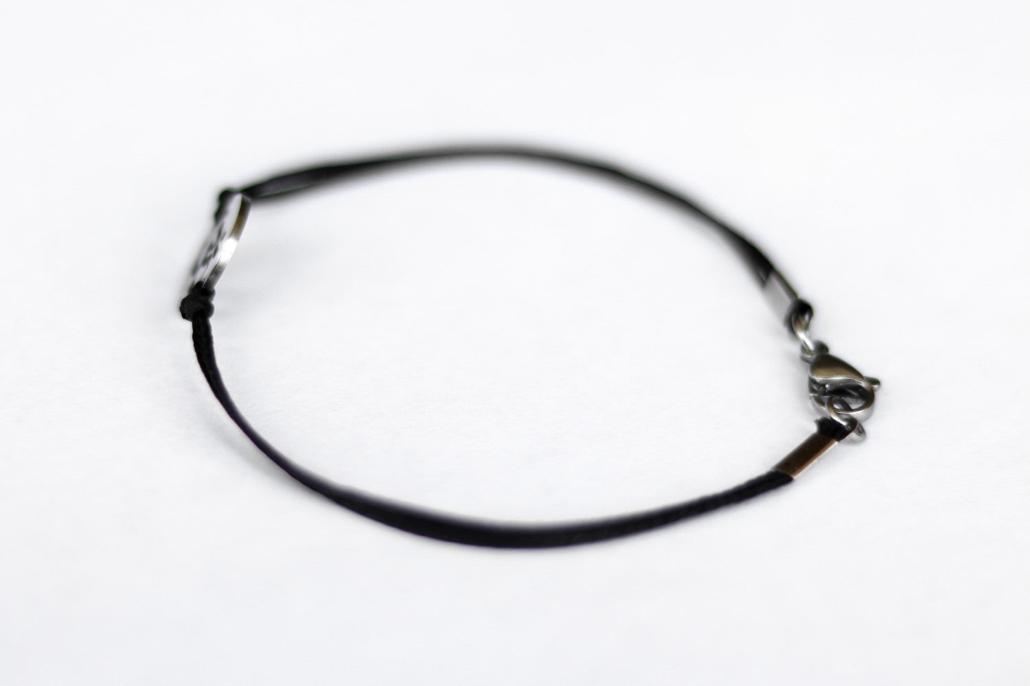 handmade silver om bracelet for men, black cord - shani and adi jewelry