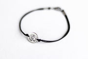 handmade silver om bracelet for men, black cord - shani and adi jewelry