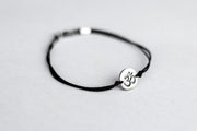 handmade silver om bracelet for men, black cord - shani and adi jewelry