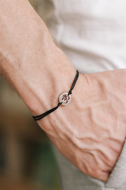 handmade silver om bracelet for men, black cord - shani and adi jewelry