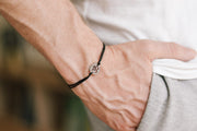 handmade silver om bracelet for men, black cord - shani and adi jewelry