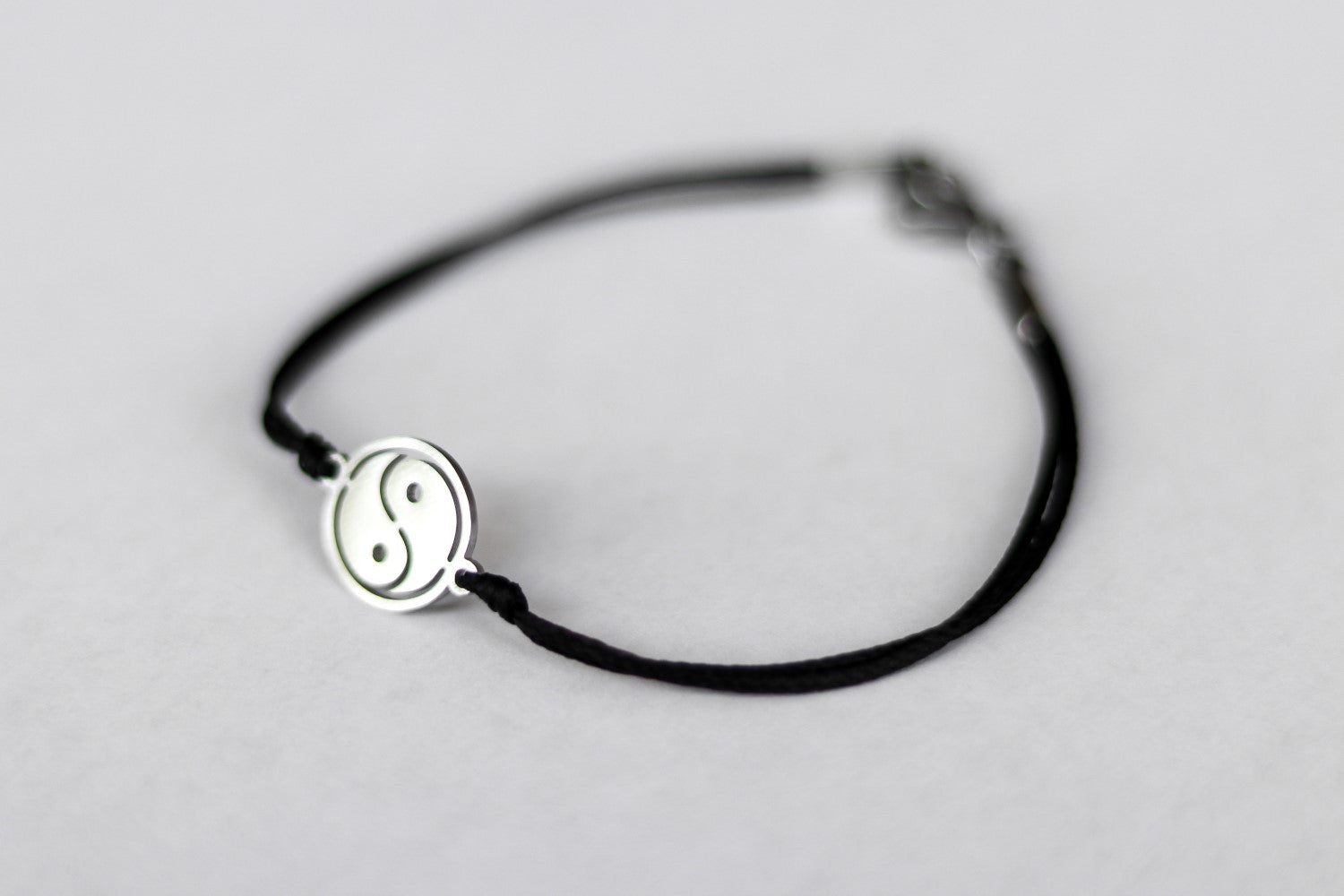 handmade silver yin and yang bracelet for women, black cord - shani and adi jewelry
