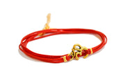 Wrapped red bracelet with gold tone Om charm - shani-adi-jewerly
